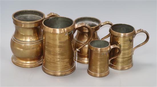 Five 19th century bell metal mugs height 17cm